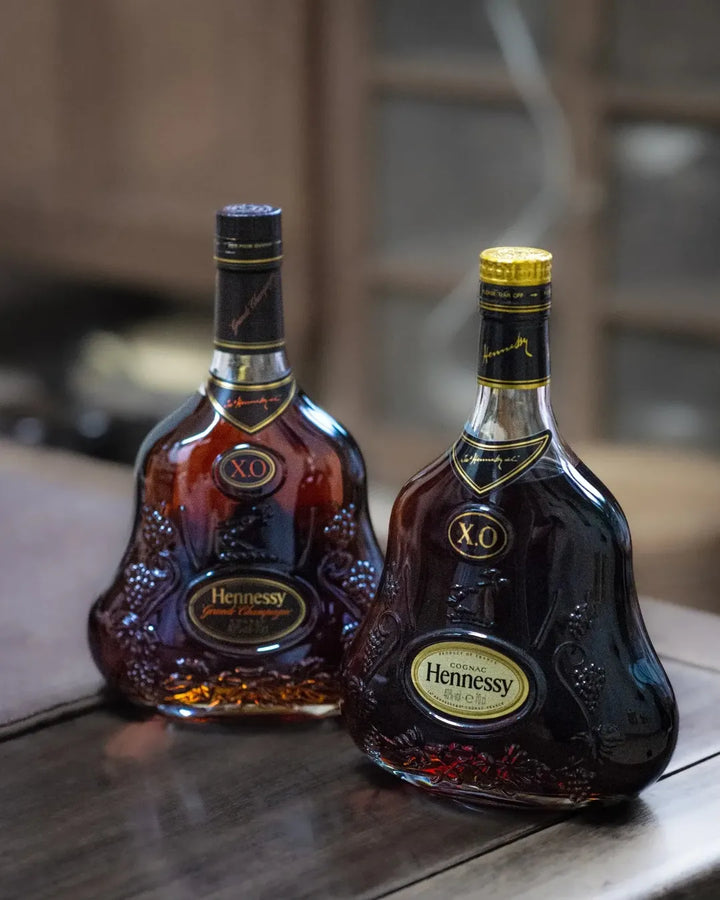 Two Older Hennessy X.O Bottles — Grade and Condition reference image for identification and condition review